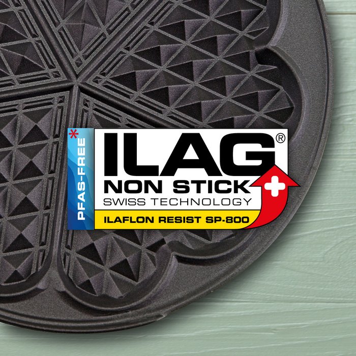 Black coated iron for heart shaped waffles - ILAG logo with yellow shaded lettering Ilaflon Resist SP-800 lettering in the center and on the left hand side an extra labeling "PFAS-FREE" in blue