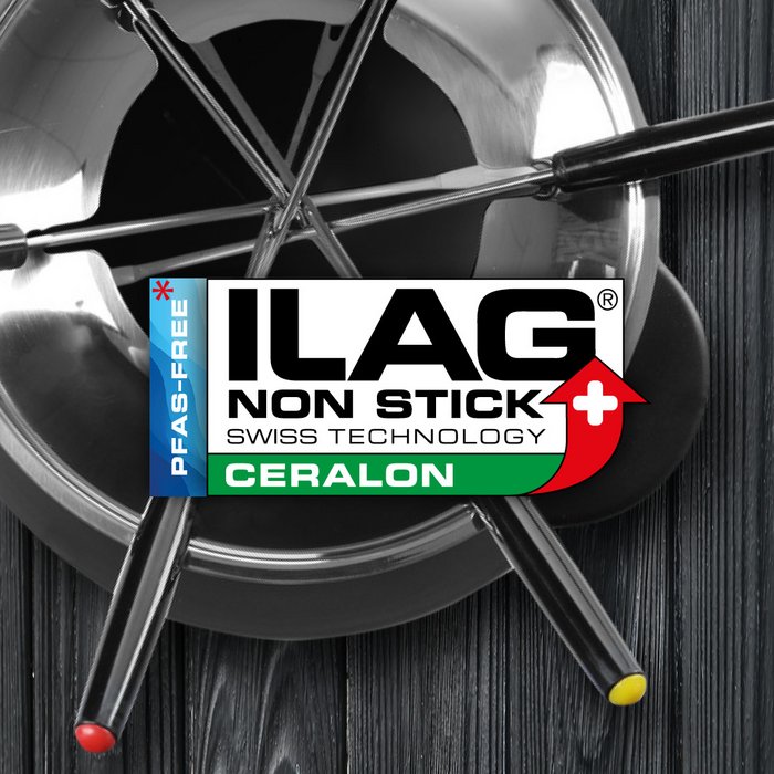 View from top on a coated fondue pot with four forks- ILAG logo with green shaded Ceralon lettering in the center and on the left hand side an extra labeling "PFAS-FREE" in blue