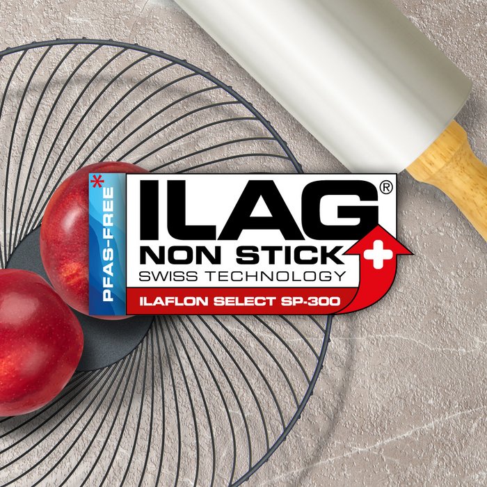 Black metal fruit basket and a aluminium colored rolling pin - ILAG logo wiht red shaded Ilaflon Select SP-300 lettering in the center and on the left hand side an extra labeling "PFAS-FREE" in blue